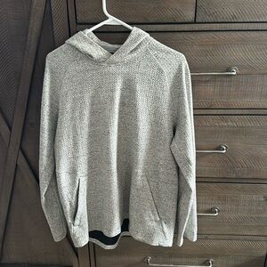 Lululemon pull over hoodie in gray and white. Size is large.